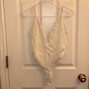 White deep plunge tank bodysuit
